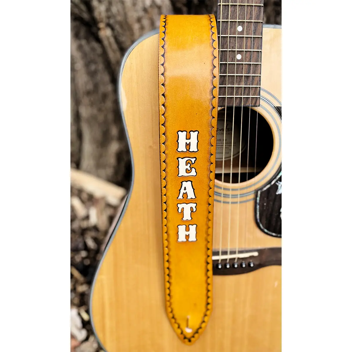 Tan Personalized Leather Guitar Strap with White letter placed vertically down the front of the strap