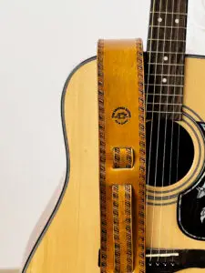 Back of Wolf Guitar Strap showing adjustment holes and brand
